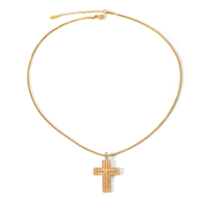 Macro shot of gold-plated cross pendant with cubic zirconia and adjustable box chain link