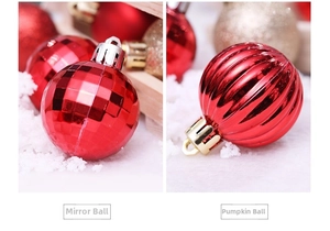 Detailed view of red faceted mirror ball and ribbed pumpkin bauble Christmas ornaments