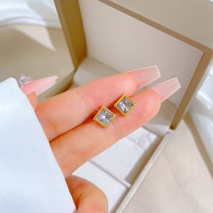 Handheld square cubic zirconia earrings in gold titanium steel with a minimalist finish