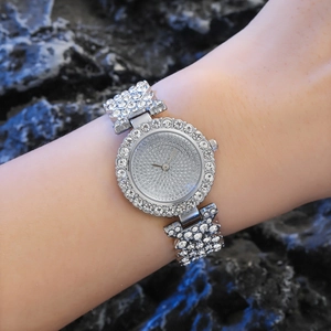 Elegant ladies quartz watch with full rhinestone embellishment on a silver metal strap