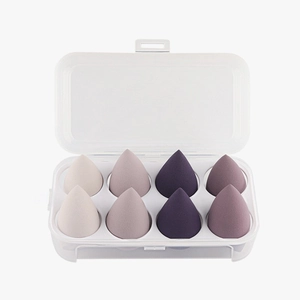 Set of 8 purple gradient teardrop makeup sponges in a transparent plastic storage box