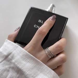Close-up of minimalist 925 sterling silver anchor chain rings worn on a hand