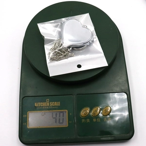 Polished heart locket pendant necklace with fine chain weighing 4.0g on digital scale