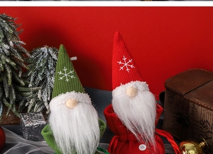 Detail of red and green faceless gnome candy bags for Christmas decorations