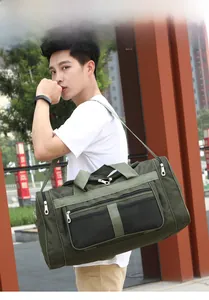 Detailed view of army green travel bag with mesh pocket and reinforced shoulder straps
