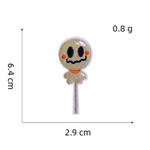 Macro shot of Halloween ghost lollipop embroidery patch with dimensions 6.4x2.9cm