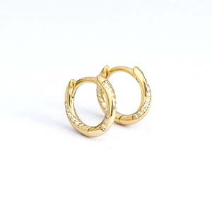 Minimalist gold S925 sterling silver huggie earrings featuring sparkling cubic zirconia