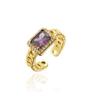 Detailed macro of gold chain texture ring with purple gemstone and zircon accents