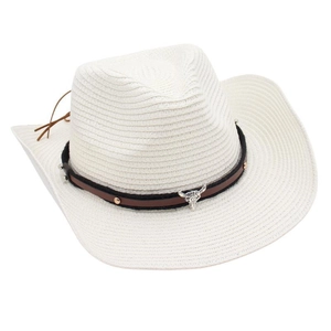 Detailed macro view of white woven cowboy hat with bull head metal emblem and leather band