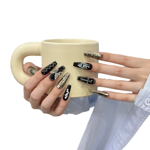 Handmade Gothic press-on nails featuring silver crosses, blue eyeballs and 3D charms