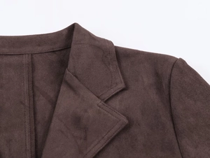 Detail of dark brown faux suede jacket collar and shoulder with fine stitching