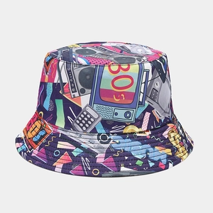 Detailed close-up of retro 80s tape and radio patterns on a double-sided bucket hat
