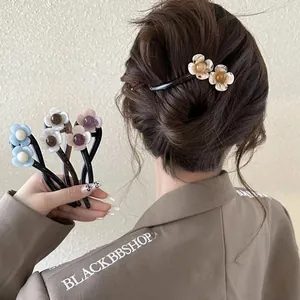 Close-up of pearlized resin flower hair clips in various colors with elegant bead centers