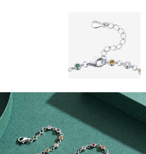 Detailed view of 925 sterling silver bracelet with multi-color gemstone bubble charms