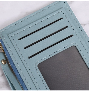 Detail of Morandi blue PU leather wallet featuring card slots and a smooth metal zipper