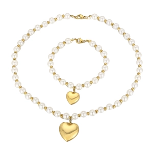 Elegant pearl necklace and bracelet set featuring gold heart pendants on white background