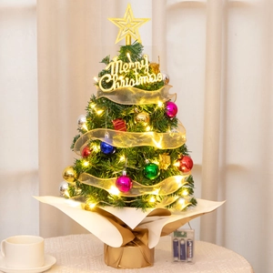 Close-up of 55cm mini Christmas tree with LED lights and colorful ornaments on a desk