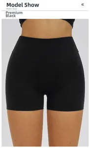 Detail show of premium black high-waisted yoga shorts with elastic tummy control fabric