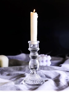 Close-up of Roman column style crystal glass candle holder with elegant ribbed texture