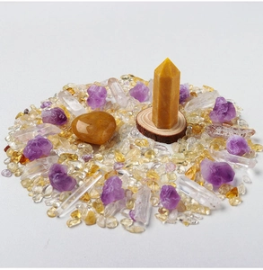 Detailed arrangement of citrine pillars, amethyst raw stones, and white crystal points