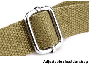 Macro shot of olive green canvas adjustable shoulder strap with silver metal buckle detail