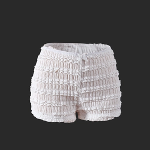 Détail du short de sécurité en dentelle blanche avec volants et nœud à la taille