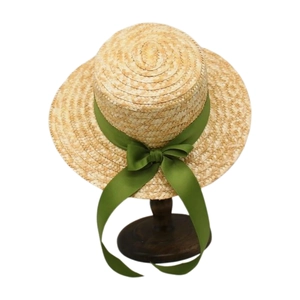 Flat top straw boater hat for women with wide brim and green ribbon bow decoration