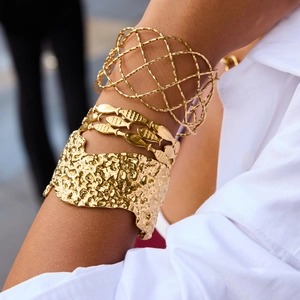 Three-piece gold stainless steel bracelet set with hammered texture and hollow design