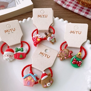 Set of 4 festive Christmas hair ties featuring Santa Claus, reindeer, and bear charms