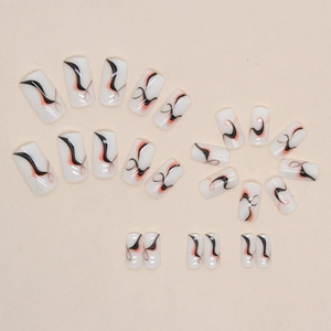 Abstract wave press-on nails in white, black, and orange with glossy finish 24pcs set
