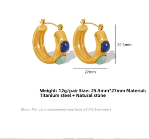 Detail view of gold titanium C-shaped earrings with inlaid blue and green natural stones