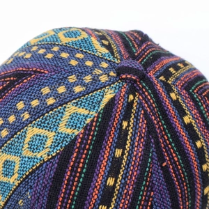 Macro shot of ethnic bohemian woven pattern details on an outdoor baseball cap crown