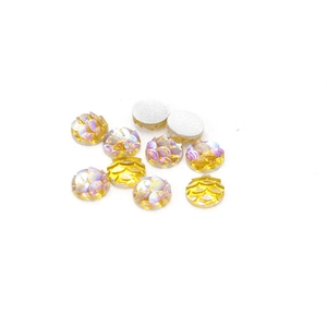 Close-up of 6mm golden AB iridescent scale pattern resin cabochons with flat back base