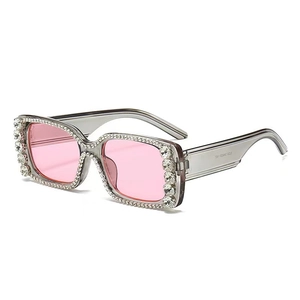 Oversized square rhinestone sunglasses with grey frames and pink tinted lenses
