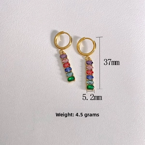 Detailed view of 18K gold earrings with colorful zircon dangles and size markers