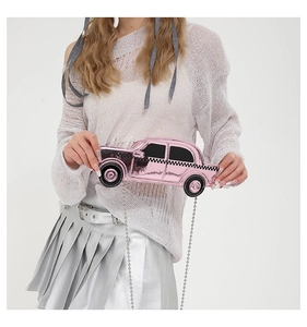 Pink car-shaped shoulder bag featuring checkerboard stripes and metal ball chain