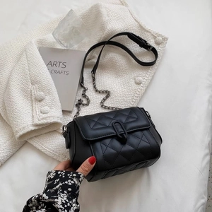 Chic black quilted leather crossbody bag with chain strap and gold clasp closure