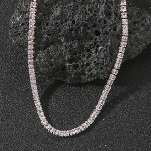 Detailed macro view of rose gold tennis necklace with square cut sparkling zircons