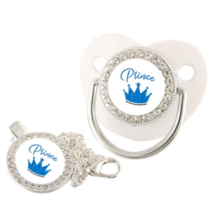 Detailed view of baby pacifier set with silver rhinestones and blue Prince crown design