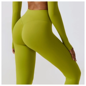 Detail of high-waist green yoga pants showing V-shaped waist and butt lifting effect
