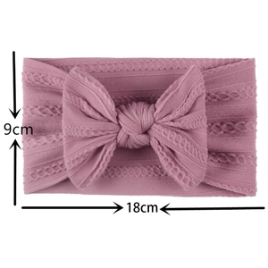 Detailed size view of pink knitted nylon bow headband for baby girls 18cm x 9cm