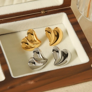 Polished 18K gold and silver stainless steel 3D heart stud earrings in a wooden box