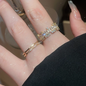 Detail of 18k gold plated baguette zircon rings showing intricate craftsmanship and shine