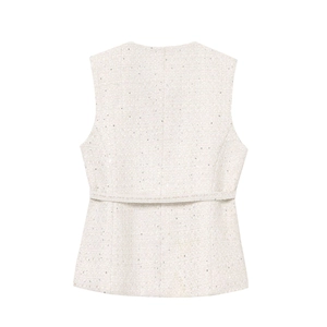 Macro detail of beige tweed vest fabric texture and waist tie on the back