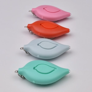 Leaf-shaped personal safety alarms in pink, orange, blue, and green on a white background
