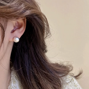 Minimalist pearl stud earring for women featuring elegant glossy white sphere design