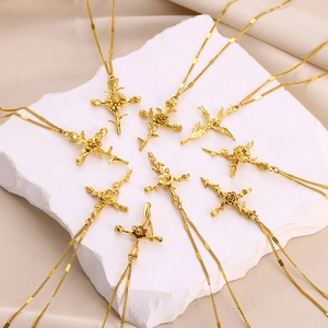 Golden flower cross necklace set featuring intricate rose designs on elegant stone base