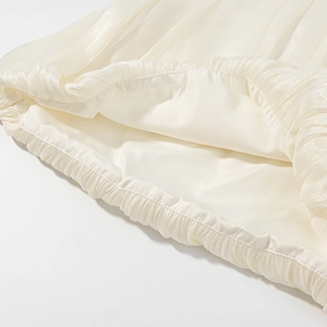 Elegant sleeveless pleated top with a round neck in premium cream white fabric