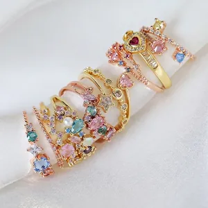 Luxurious gold heart zircon ring set with pearls and micro-pave stones on white silk