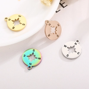 Compass star pendant set in gold, rose gold, silver, and rainbow finishes for necklaces